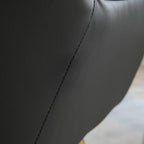 Dark grey PU armrest with stitched seam and smooth upholstery finish