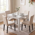 White square dining table with four legs on a light rug.