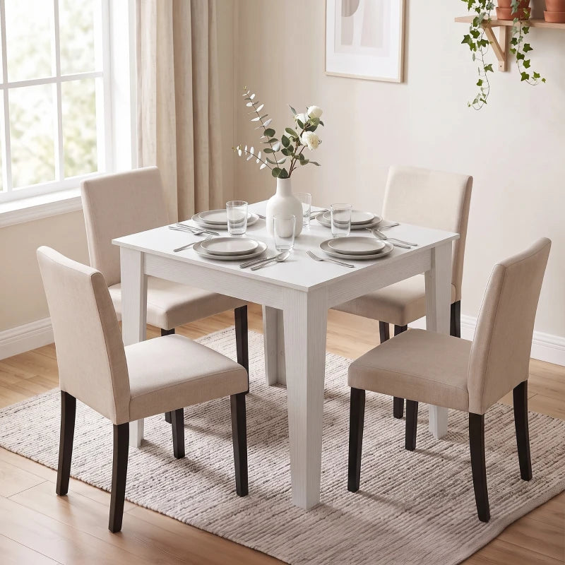 White square dining table with four legs on a light rug.