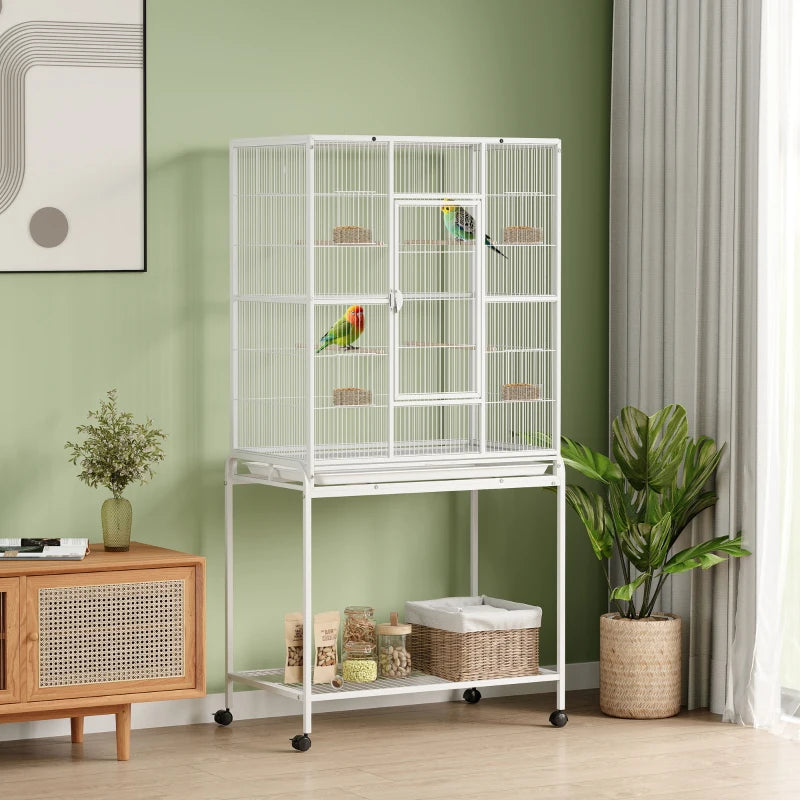 White bird cage on wheels with front shelf and side access doors for birds
