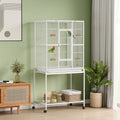 White bird cage on wheels with front shelf and side access doors for birds