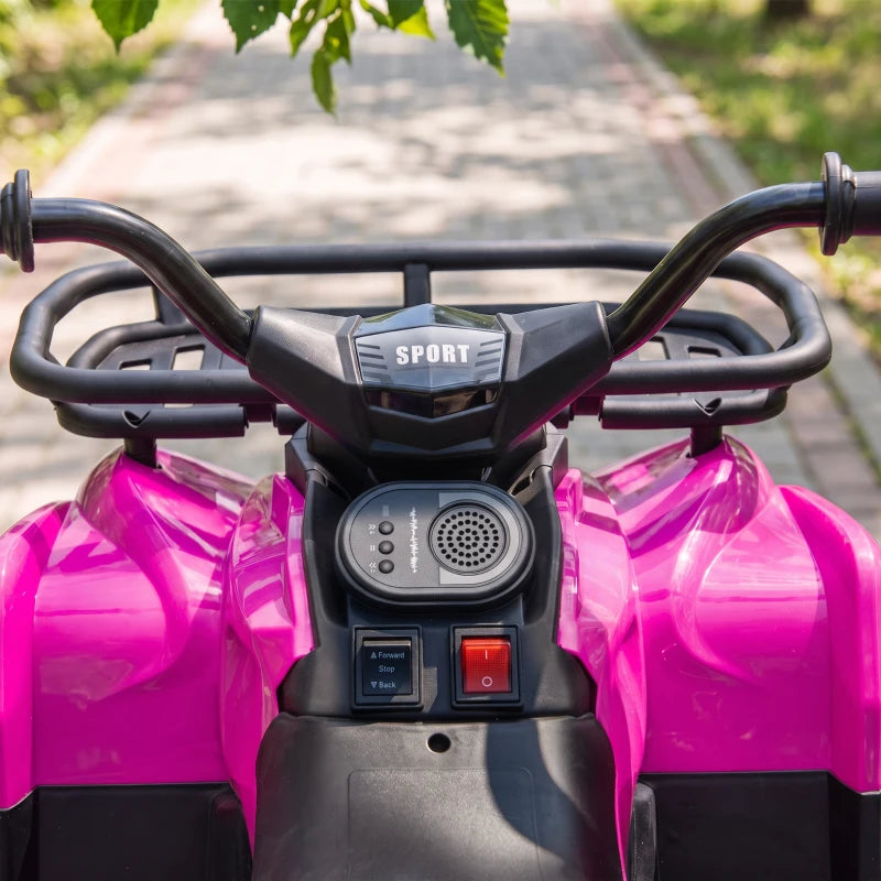 Pink kids electric quad bike dashboard with speaker grille and handlebar controls