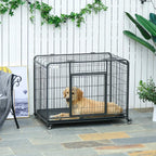 Dark grey metal dog crate kennel with front door, open area inside, and caster wheels