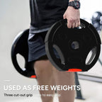 Black weight plate held by hand, three grip holes, orange edge accent