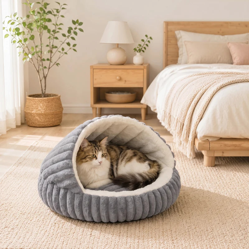 Grey plush cat cave house with arched entrance; two cats resting inside