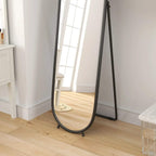 Black two-way curved full-length oval mirror with front glass and standing legs.