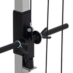 Black cable crossover power rack close-up of handle mount with pin and steel frame