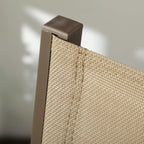 Close-up of khaki mesh chair corner with dark aluminum top cap