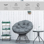 Grey cushioned Papasan swivel chair with woven rattan basket base and round seat