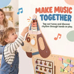 Child playing with wooden dachshund busy board panel with keys and tap tempo bars