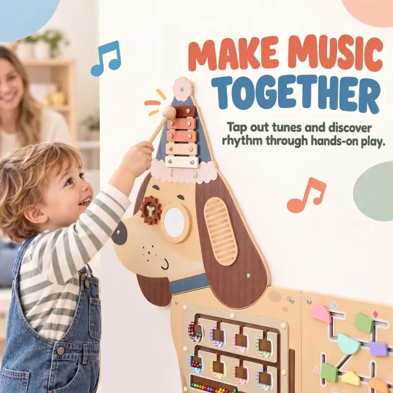 Child playing with wooden dachshund busy board panel with keys and tap tempo bars