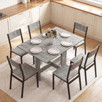 Grey expanded dining table with both leaves open and tabletop set