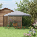 Outdoor chicken coop run with grey roof over chain-link mesh pen