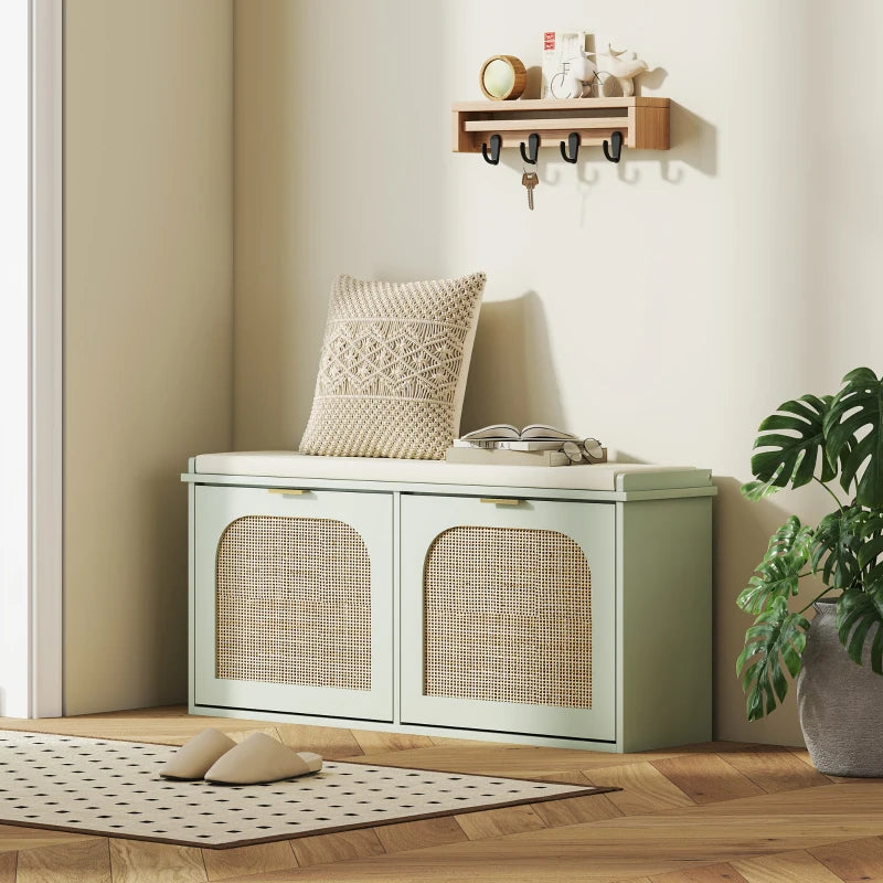 Light green shoe bench with padded seat, two rattan cabinet doors, and top storage