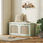 Light green shoe bench with padded seat, two rattan cabinet doors, and top storage