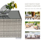 Square gray wicker coffee table with glass top shown with garden furniture