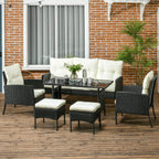 Rattan garden lounge set with cream cushions, black wicker chairs, footstools and glass table