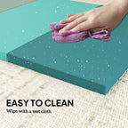 Mixed green workout mat surface with water droplets and easy-clean wipe texture