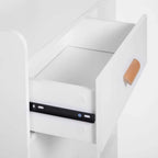 White cabinet interior with drawer slide and orange-brown handle
