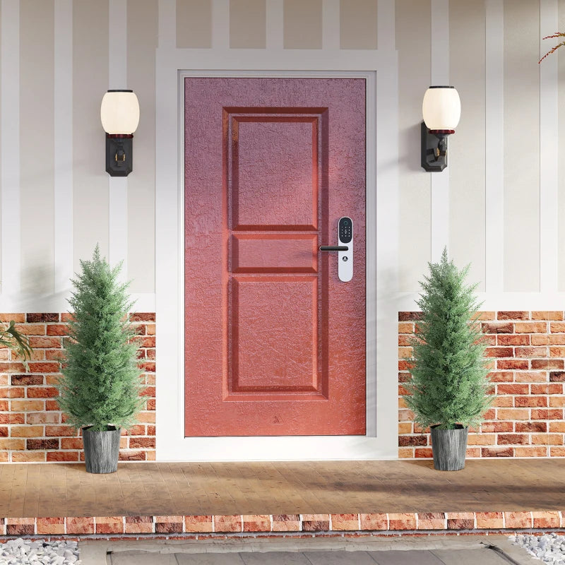Two artificial cypress trees with green foliage in gray textured pots, entryway pair