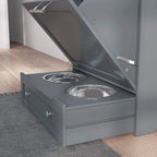 Grey pet feeder cabinet with two raised stainless steel bowls in open drawer
