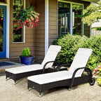 Brown rattan sun loungers with adjustable backs, white cushions, and wheeled bases