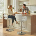 White bar stool with padded backrest and armrests, chrome swivel base at kitchen counter