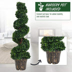 Tall artificial spiral plant in a brown textured pot with dense green leaves