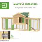 Large wooden chicken coop with green roof, multiple green entry doors, and ramp entrance