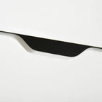 Wood-look flip drawer handle opening on white shoe cabinet front