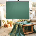 Green waterproof tarpaulin sheet spread flat over outdoor table