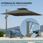 Grey cantilever umbrella with open canopy and pole, hydraulic-style opening linkage.