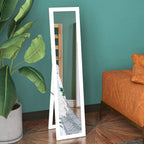 White full-length floor mirror with rectangular frame, angled view with home interior
