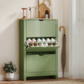Green slim shoe cabinet with open top shelf and flip drawer, storing pairs of shoes