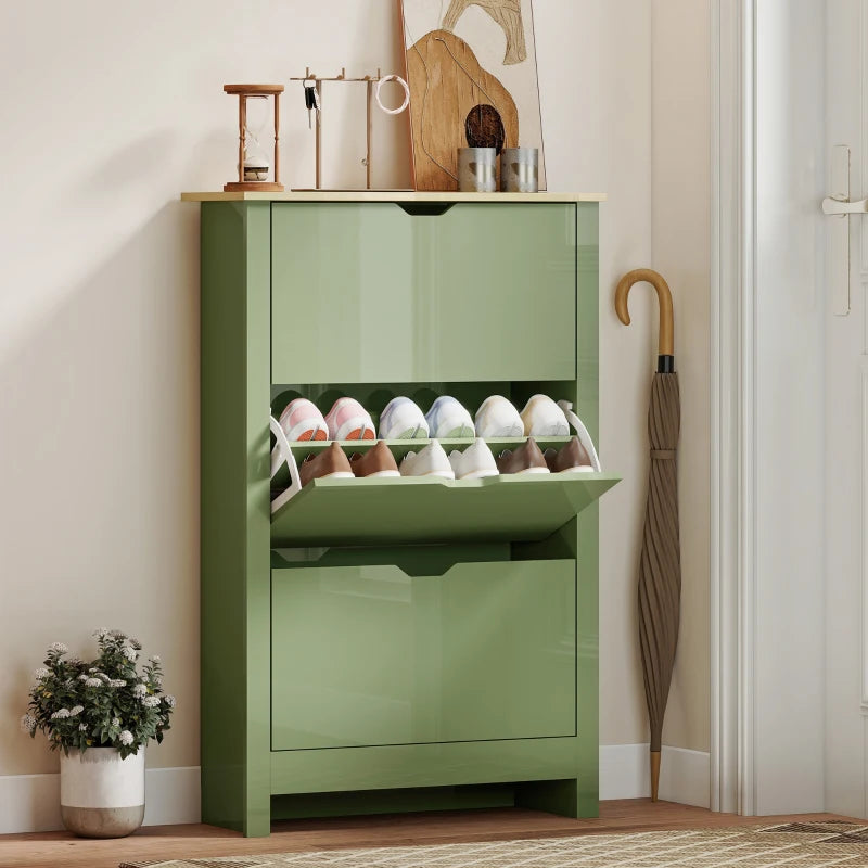 Green slim shoe cabinet with open top shelf and flip drawer, storing pairs of shoes