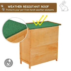 Wooden guinea pig hutch with green weather-resistant roof panel and side wall doors
