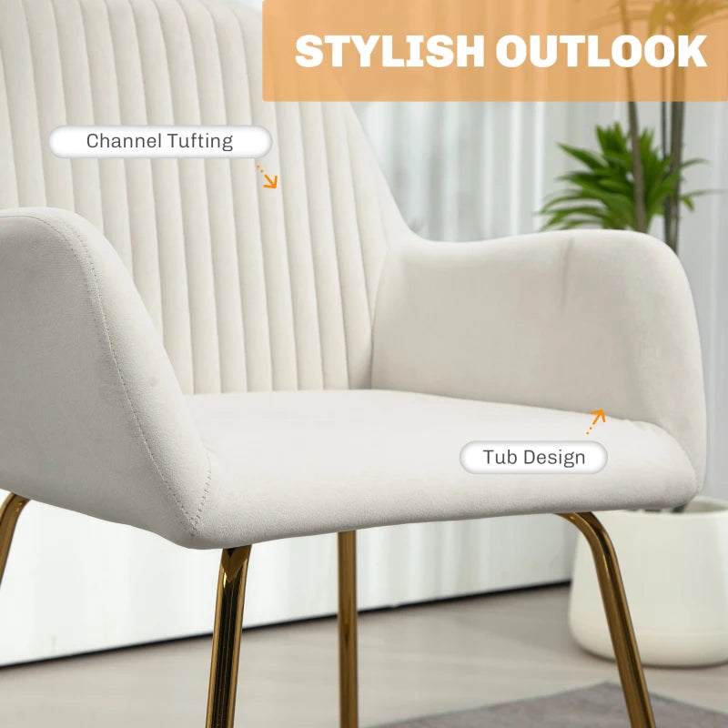 Cream upholstered accent chair detail: channel tufting along the back and padded armrest