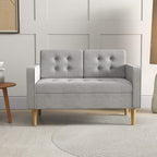 Light grey tufted 2-seat sofa with buttoned back panels and wooden legs