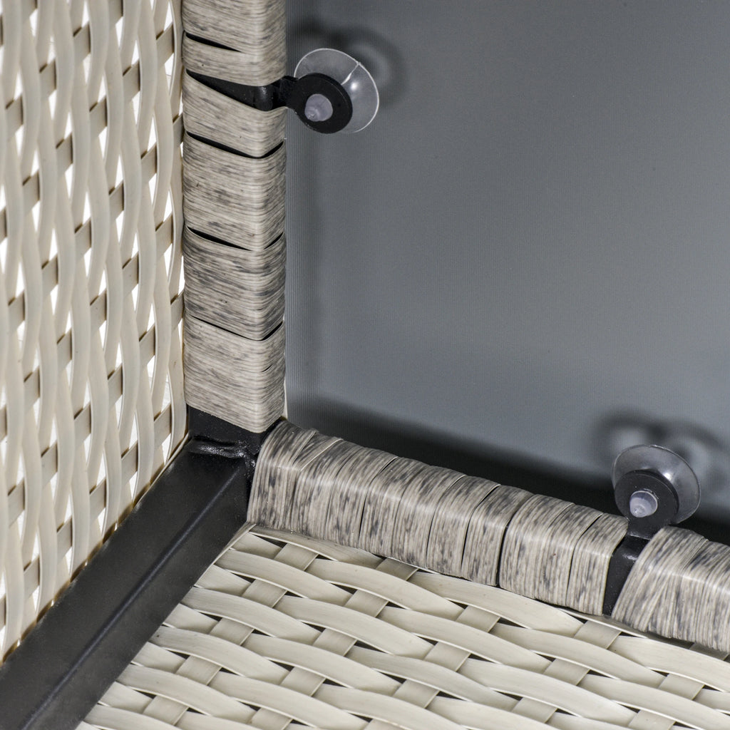 Close-up of the table's glass top supports and wicker frame