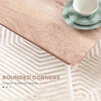 Compact dining table with rounded brown tabletop corner and white leg, with plates