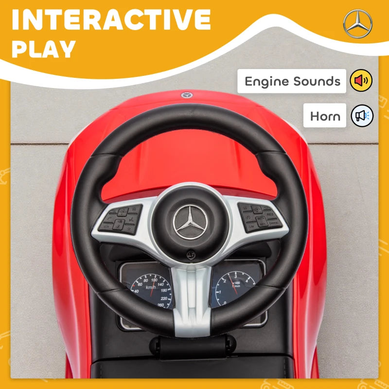 Red Mercedes-Benz ride-on steering wheel with black grips and dashboard gauges