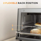 Open mini oven showing adjustable rack positions with baked bread inside.